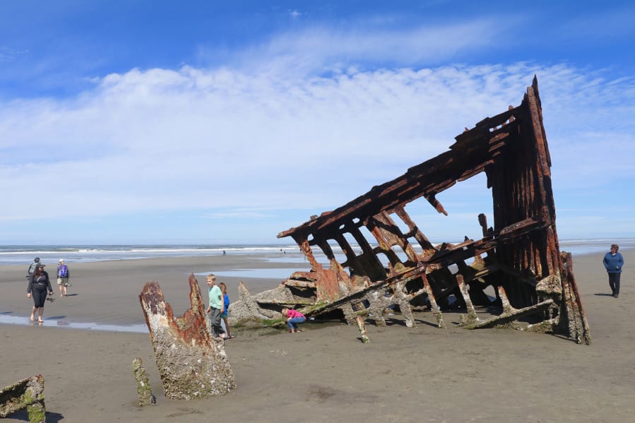 The bare bones of the Peter Iredale, a British four-masted bark that ran aground in 1906, are a magnet for beach visitors to Fort Stevens State Park, Ore.