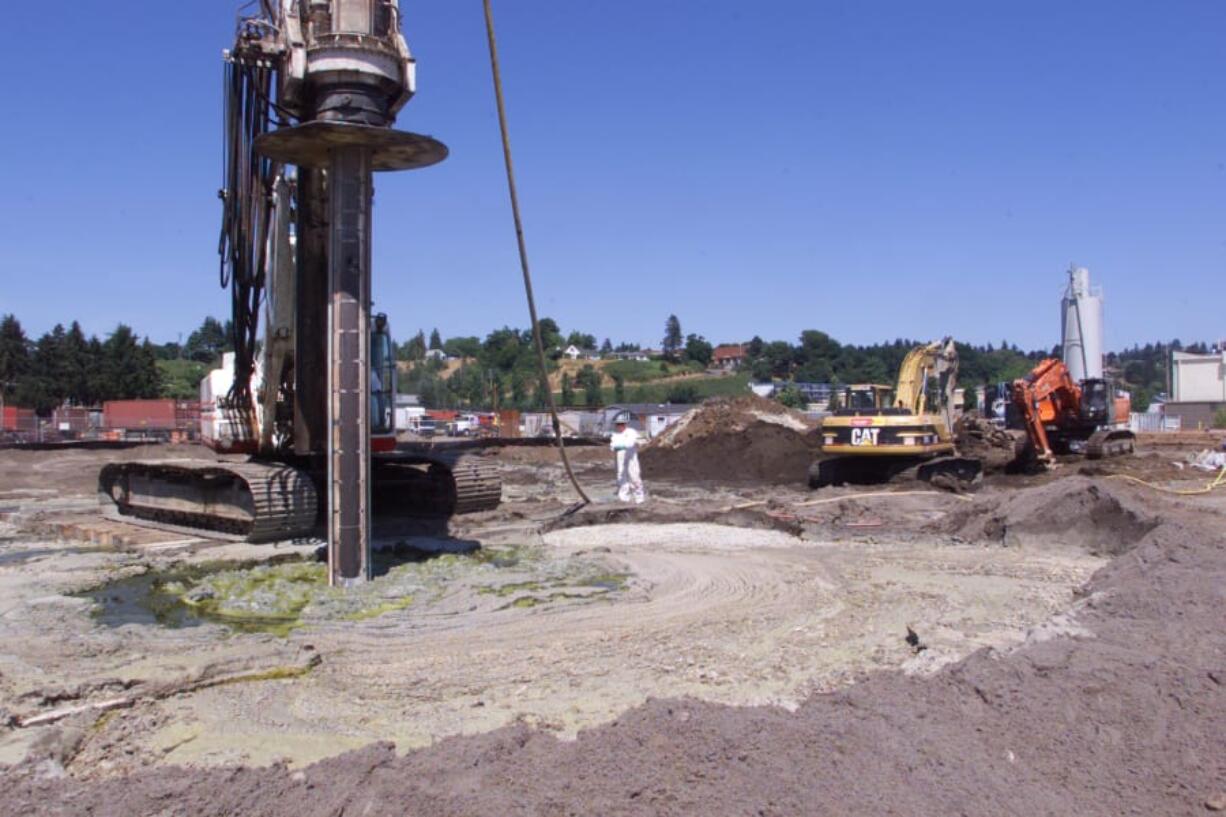 Workers begin the cleanup of the Frontier Hard Chrome site at 113 Y St. in Vancouver in June of 2003. After years of cleanup work, the Environmental Protection Agency deleted the site from its Superfund list effective Monday.