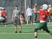 Linebackers coach Parker Henry barks out instructions to the defense during a practice last week at Portland State.