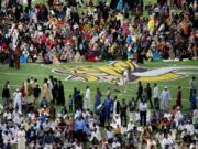 Muslim worshipers gather Tuesday on the field for the morning prayers for Eid ul-Adha at U.S. Bank Stadium in Minneapolis, Minn. To celebrate Eid ul-Adha, the organization Super Eid hopes to bring together over 50,000 Muslims to pray.