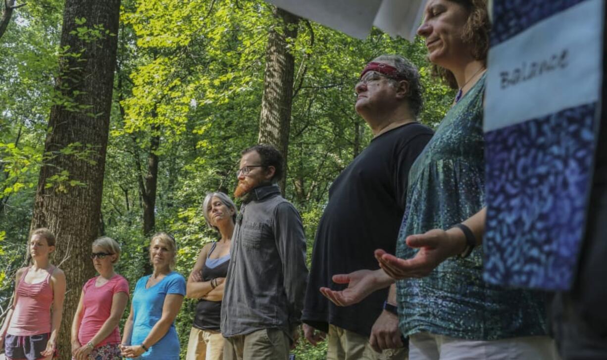 Participants form a circle to conclude their service Aug. 5 at the Church of the Wild in McLean, Va.