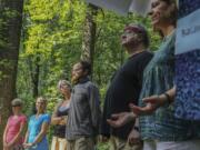 Participants form a circle to conclude their service Aug. 5 at the Church of the Wild in McLean, Va.