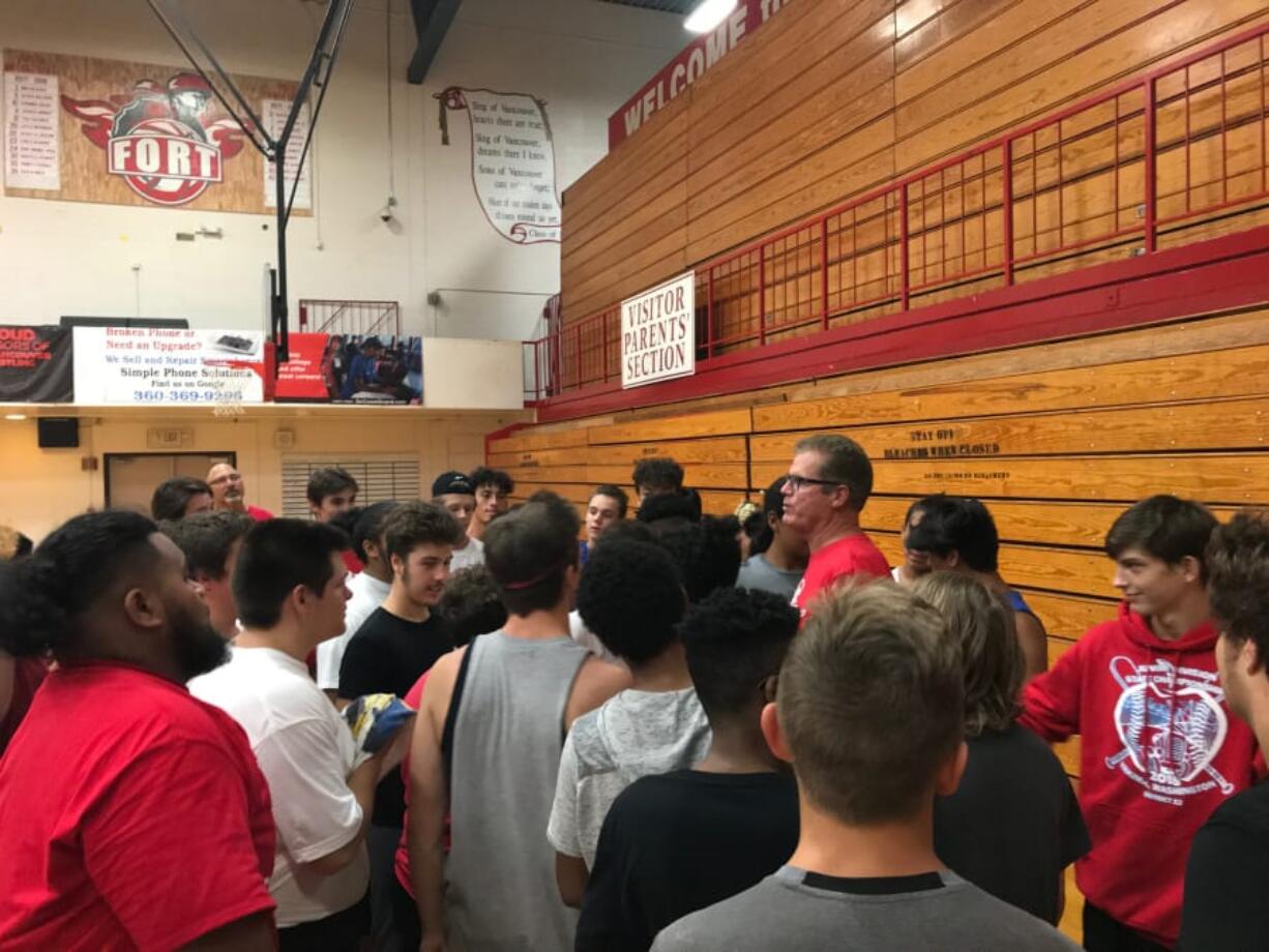 New Fort Vancouver football coach Neil Lomax talks to players on the first day of practice on Aug. 15. More than 50 players turned out for the team, many more than in the previous year.