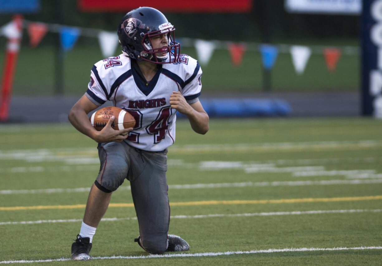 King's Way's Mat Fronk (24) celebrates an interception in the first quarter of Thursday's season opener against Fort Vancouver at Kiggins Bowl on Aug. 30, 2017.