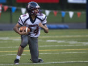 King's Way's Mat Fronk (24) celebrates an interception in the first quarter of Thursday's season opener against Fort Vancouver at Kiggins Bowl on Aug. 30, 2017.