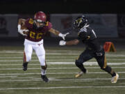 Alisha Jucevic/The Columbian A.J. Dixson, left, has moved to quarterback, one of many changes this season for a Prairie team looking to break into the playoffs.