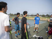 Mountain View freshman James Bertheau, left, sophomore Nathaniel John, sophomore Vincent Hsu, junior Jerry Huang, and senior Darius Leahu take a water break during an informal summer hit session.