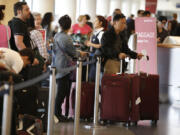 Long lines congest Los Angeles International Airport on the Friday before Labor Day in 2015.