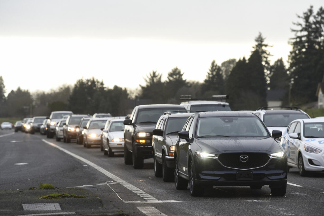 Eastbound vehicles line up just behind the crosswalk along state Highway 500 at the intersection of Northeast Stapleton Road and Northeast 54th Avenue during rush hour earlier this year. Some people worry the Washington State Department of Transportation’s plan to close the crossing for several years while it waits to secure funding to build a new, likely above-grade crossing, will temporarily put pedestrians in harm’s way.