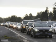 Eastbound vehicles line up just behind the crosswalk along state Highway 500 at the intersection of Northeast Stapleton Road and Northeast 54th Avenue during rush hour earlier this year. Some people worry the Washington State Department of Transportation’s plan to close the crossing for several years while it waits to secure funding to build a new, likely above-grade crossing, will temporarily put pedestrians in harm’s way.