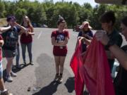 Members of GeoGirls geology and technology field camp burst into laughter as a 5-foot helium balloon pops before a mapping exercise at Mount St. Helens on Wednesday. The group decided to troubleshoot the situation and found ways to complete the mapping exercise by foot instead of with the balloon.