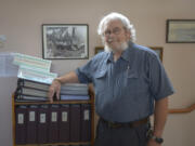 Washougal: Brian McClatchie, board member with the Camas-Washougal Historical Society, poses with research notes and a second set of Camas-Washougal Homestead Records donated to the Two Rivers Historical Museum.