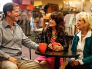 Russ, Gayle and Susan Beacock, owners of Beacock Music, sit at the store’s second location in Eugene, Ore., before its scheduled opening Monday. Below: The exterior of the new Beacock Music store in Eugene, Ore. The store is much smaller than the original location in Vancouver — just 3,400 square feet.