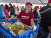 Natalie Crousore of Vancouver carries a load of fresh pancakes to the serving line during the Fred Meyer Free Pancake Breakfast at the Clark County Fair on Friday morning, Aug. 3, 2018.