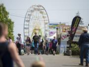 Crowds pass rides, food and exhibits as they stroll among the attractions at the Clark County Fair on Monday afternoon.