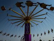 Attendees at the Clark County Fair ride the Yoyo swing ride on Tuesday afternoon, Aug. 7, 2018.