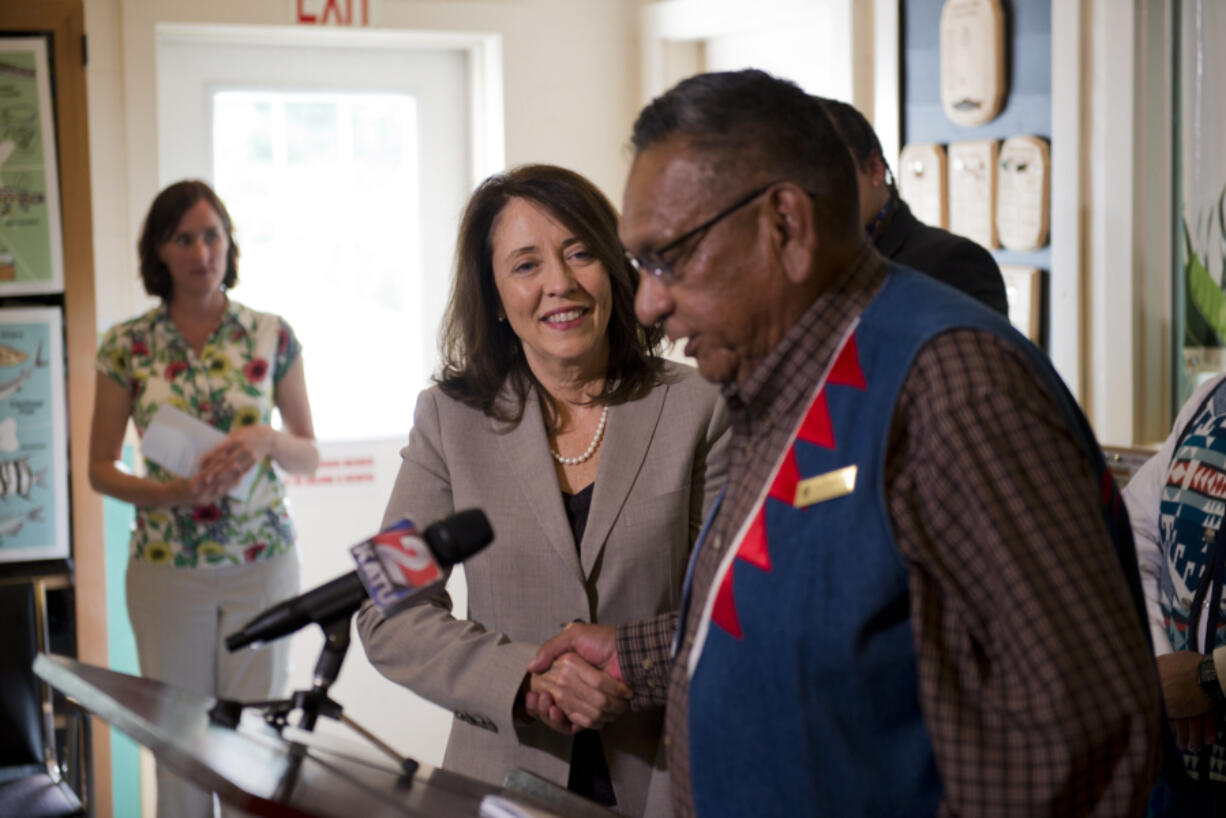 Ron Suppah, tribal council member for the Confederated Tribes of the Warm Springs Reservation of Oregon, warns that time is of the essence and asked that action be taken soon to address salmon predation by California sea lions during a Friday visit at the Columbia Springs Environmental Education Center. U.S. Sen. Maria Cantwell, D-Wash., center, stopped by the center, in part, to promote her bill that would allow tribes to kill sea lions in the Columbia River in an effort to protect the endangered salmon population.