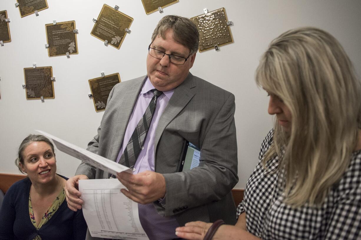 Clark County Assessor Peter Van Nortwick reads election results at the Clark County Public Service Center on Tuesday night.