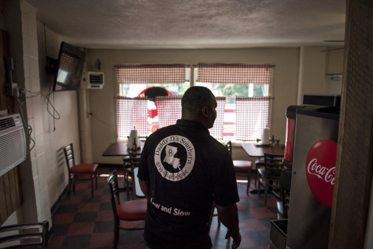 Donnie Vercher, owner of Daddy D’s Southern Style BBQ, walks through his new Woodland location while preparing for the restaurant’s grand opening. The restaurant is expected to seat about 20 inside and have an outdoor seating space.