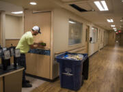 Travis Coalman with Hamer Electric installs fire alarms in the new inpatient rehab unit at PeaceHealth Southwest Medical Center, which is set to open on Aug. 27. The unit will move from the fourth floor of the Mother Joseph Building to the third floor.