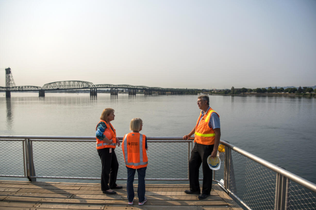 Mayor Anne McEnerny-Ogle, left, and U.S. Sen. Patty Murray, D-Wash., center, talk with Terry Snyder, who manages the city’s projects on the waterfront, during a tour of the Vancouver waterfront Wednesday morning.