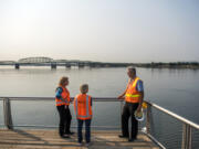 Mayor Anne McEnerny-Ogle, left, and U.S. Sen. Patty Murray, D-Wash., center, talk with Terry Snyder, who manages the city’s projects on the waterfront, during a tour of the Vancouver waterfront Wednesday morning.