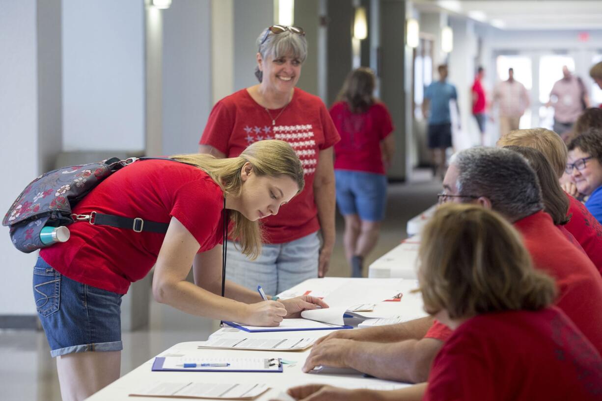 Vancouver Education Association members at a meeting at Columbia River High School on Thursday. Over the weekend, union members voted overwhelmingly in favor of a work stoppage if a new teacher contract is not in place before the start of the school year.