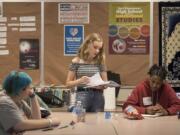 True Ware, 13, reads a story about a faded friendship while Blue Jackson, 18, at left, and Trinity Stegall, 17, listen in during a story workshop at Fort Vancouver High School. These girls are getting ready for “Girls ROAR,” a stoytelling festival set for Aug. 23 at the Kiggins Theatre in Vancouver.