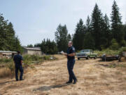 Fire Marshal Chris Drone, left, and Risk Specialist Jacob Guisinger lead a wildfire survey at a rural home on Thursday afternoon.