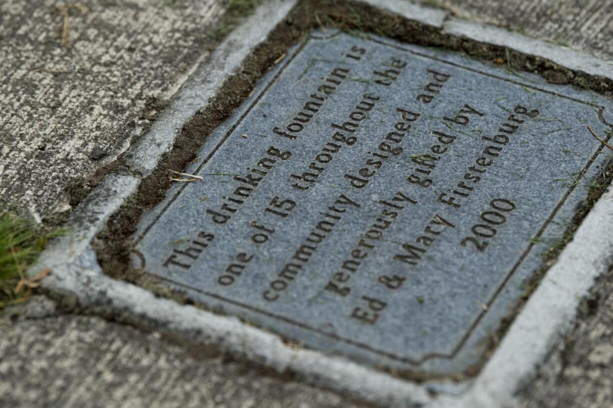 A plaque marks the donation of this Firstenburg drinking fountain, at left, on the Vancouver waterfront.