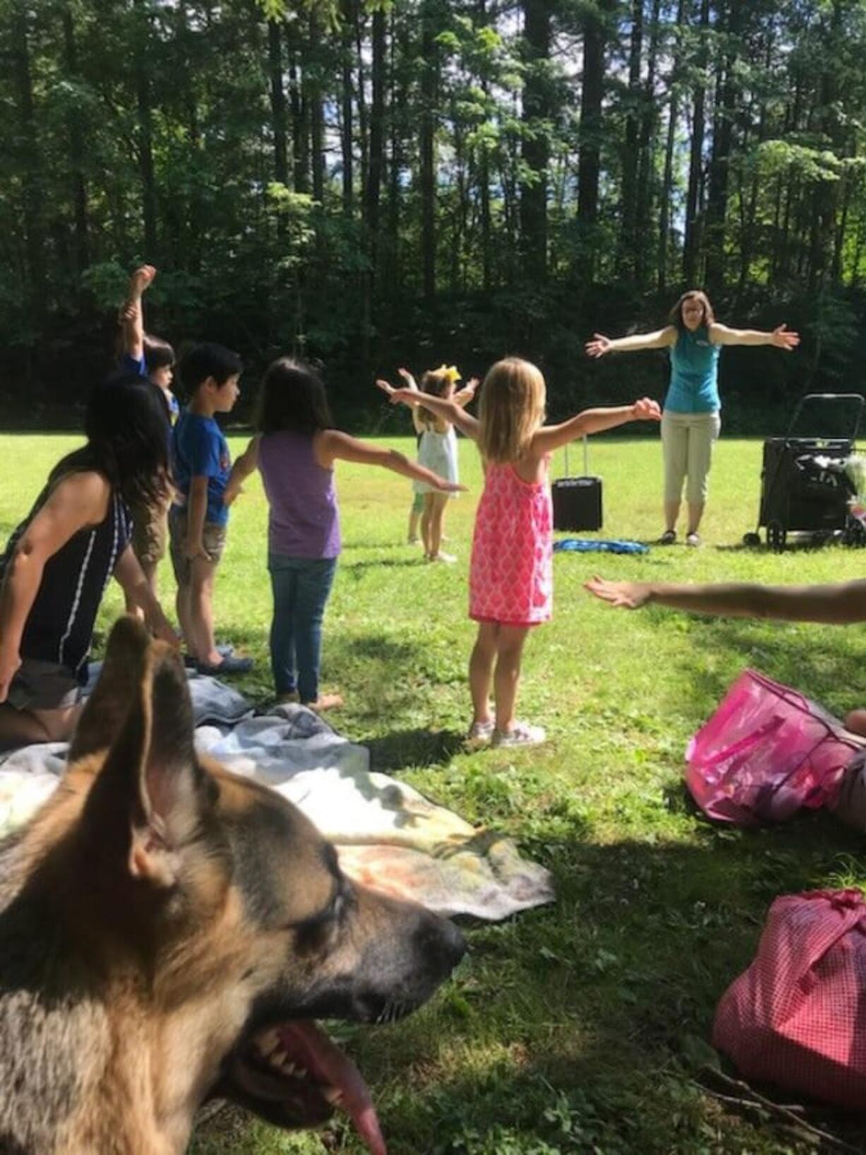 Camas: A group of kids enjoying a sunny afternoon during one of the Camas Public Library’s Storytime in Camas Parks events this summer.