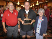 Riveridge: George Glick, director of umpires for the Junior League Baseball World Series, left, presents the Chuck McAllister Umpire Award to Joe Loftgren of Vancouver, center, along with Shirley McAllister, Chuck McAllister’s widow.