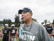 Mark Rego, Union High School assistant football coach, blows his whistle to indicate a downed ball during a two-minute drill at a Union practice on Thursday afternoon, Aug. 23, 2018.