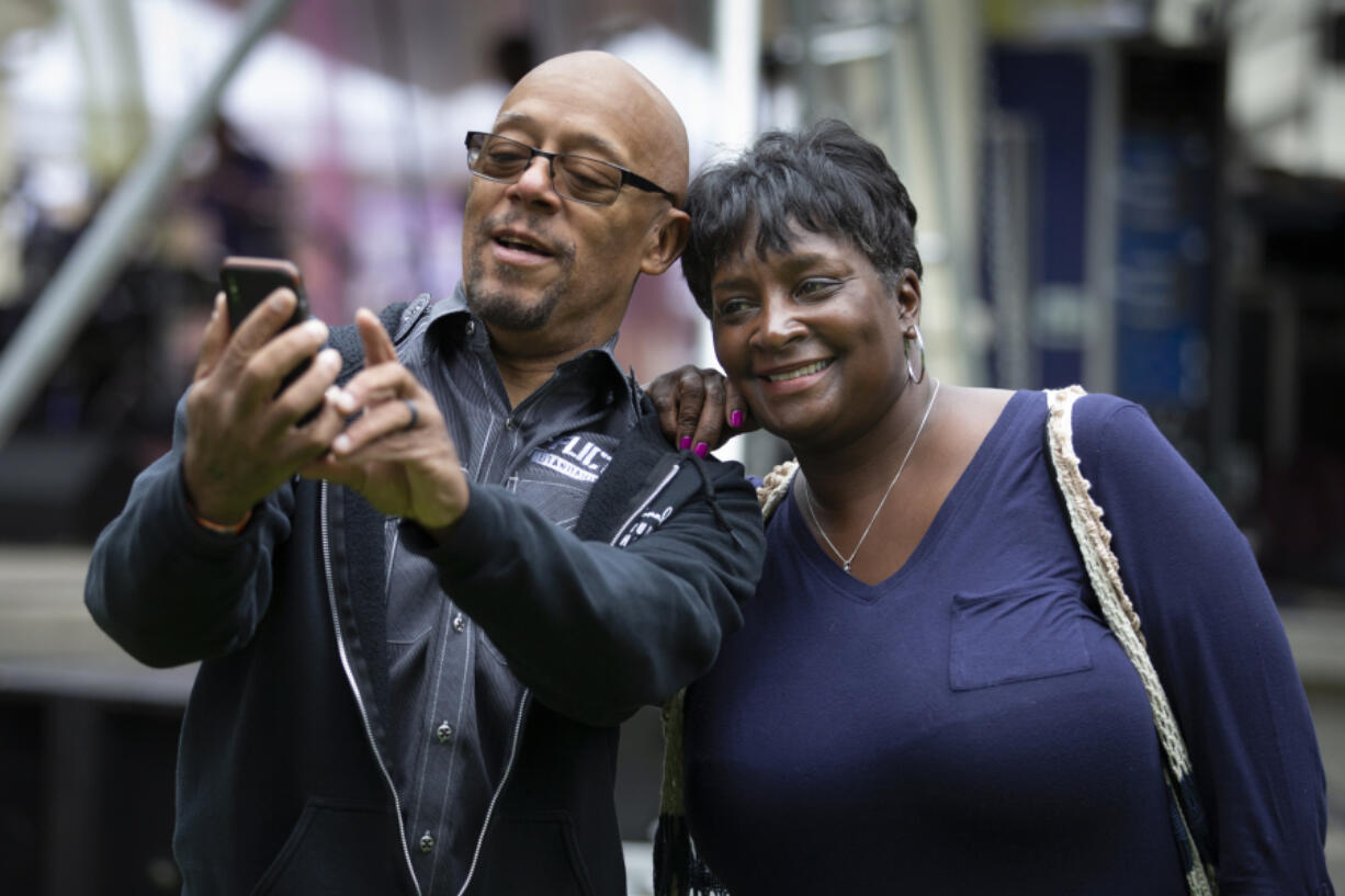 Rena Beavers, left, who plays drums for Coco Montoya’s band, poses with his cousin Renita Crowell at the Vancouver Wine & Jazz Festival Sunday at Esther Short Park. Randy L.