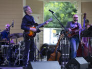 Members of the C-Mo Jazz Quartet perform at the Vancouver Wine & Jazz Festival Sunday afternoon at Esther Short Park. From left, drummer Randy Herbert, guitarist Cameron Morgan and bassist Dylan Sundstrom. Randy L.