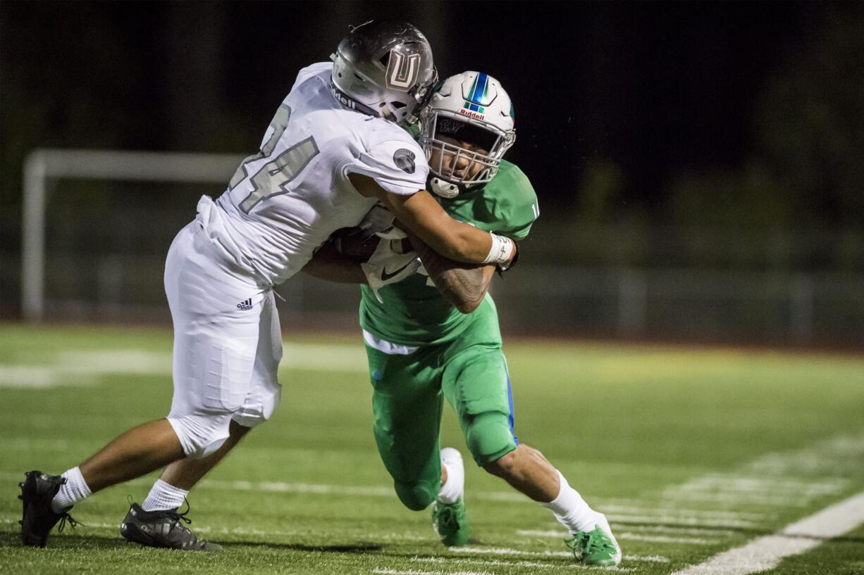 Union's Alex Gonzales (24) drives Mountain View's Makai Anderson (14) out of bounds in the fourth quarter at McKenzie Stadium on Friday night, Aug. 31, 2018.