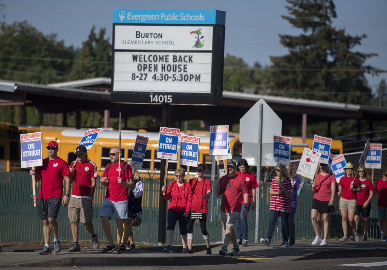 Members of the Evergreen Education Association take to the picket line outside Burton Elementary School on Tuesday morning, Aug. 28, 2018.