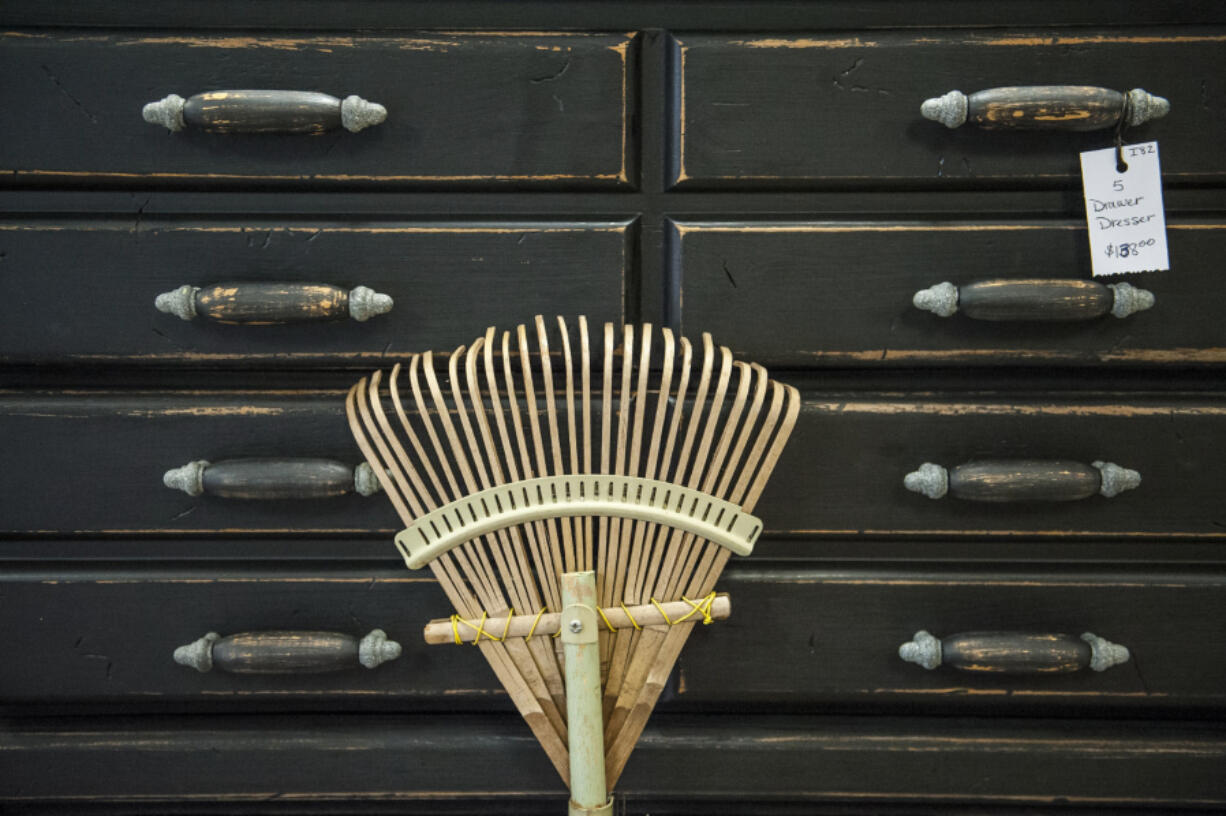 A wooden rake and dresser are seen here for sale at Rose & Thorn Boutique in Woodland. The booths at the store house hand-crafted goods from around 40 local vendors.