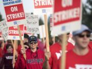 Monica Deshazer, counselor at Ridgefield High School, pickets with her fellow teachers outside the school on Wednesday morning, Aug. 29, 2018.