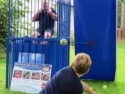 Woodland: Woodland Police Chief James Kelly sits in the dunk tank at the Friends of the Woodland Community Library’s second Bocce Ball Blowout tournament to raise funds for a new library building.