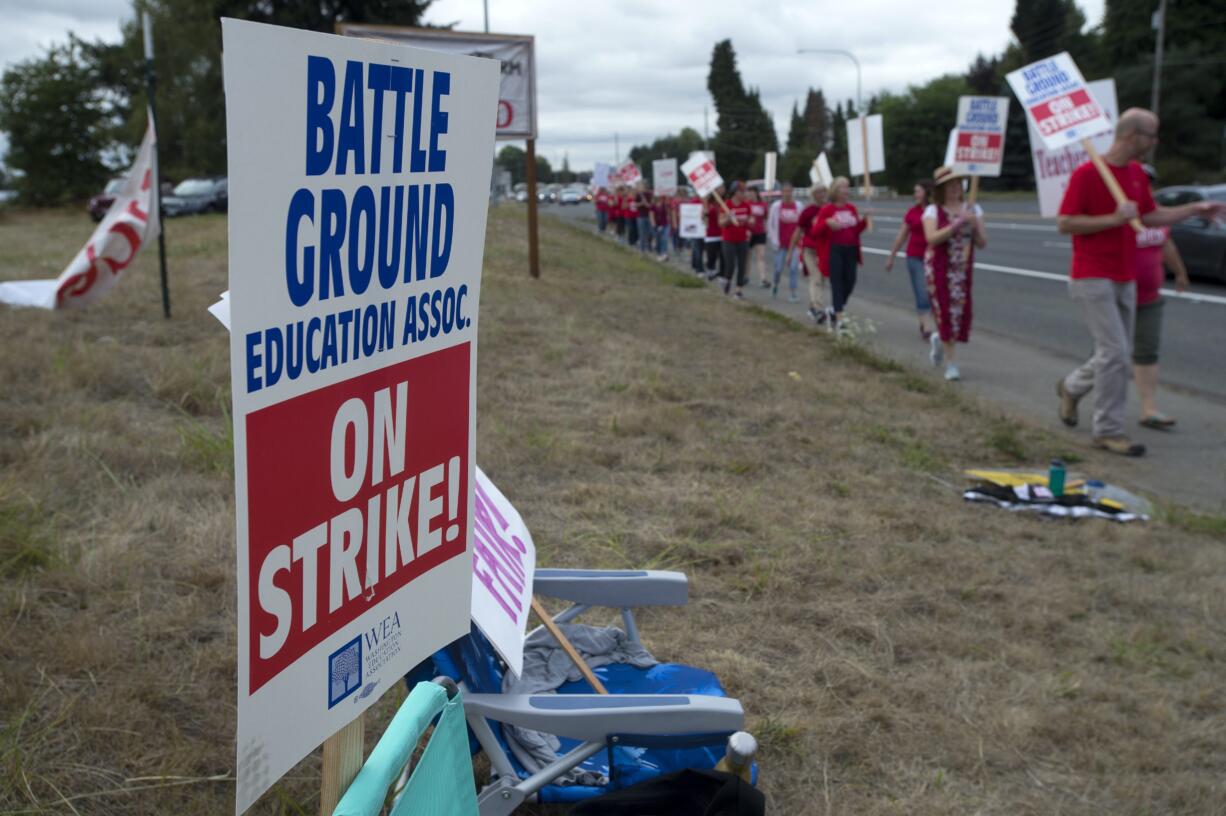 Teachers and supporters from Summit View High School and the CASEE Center greet motorists as they picket along Lewisville Highway on Thursday morning, Aug. 30, 2018.