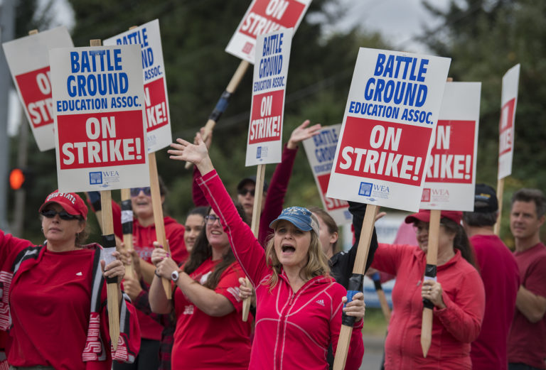 Teachers and supporters from Summit View High School and the CASEE Center greet motorists as they picket along Lewisville Highway on Thursday morning, Aug. 30, 2018.