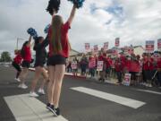 Cheerleaders from Hockinson High School show their support for teachers striking outside Hockinson Middle School as the pep band plays the high school's fight song Friday morning, Aug. 31, 2018.