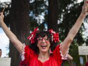 Marta Gray, 7th grader teacher at Thomas Jefferson Middle School leads a cheer while teachers rally in front of the Vancouver Public Schools' Administration Building on Friday afternoon, Aug. 31, 2018.