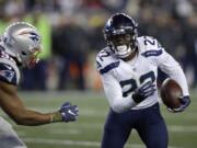 New England Patriots defensive lineman Trey Flowers (98) chases Seattle Seahawks running back C.J. Prosise (22) during the first half of an NFL football game, Sunday, Nov. 13, 2016, in Foxborough, Mass.