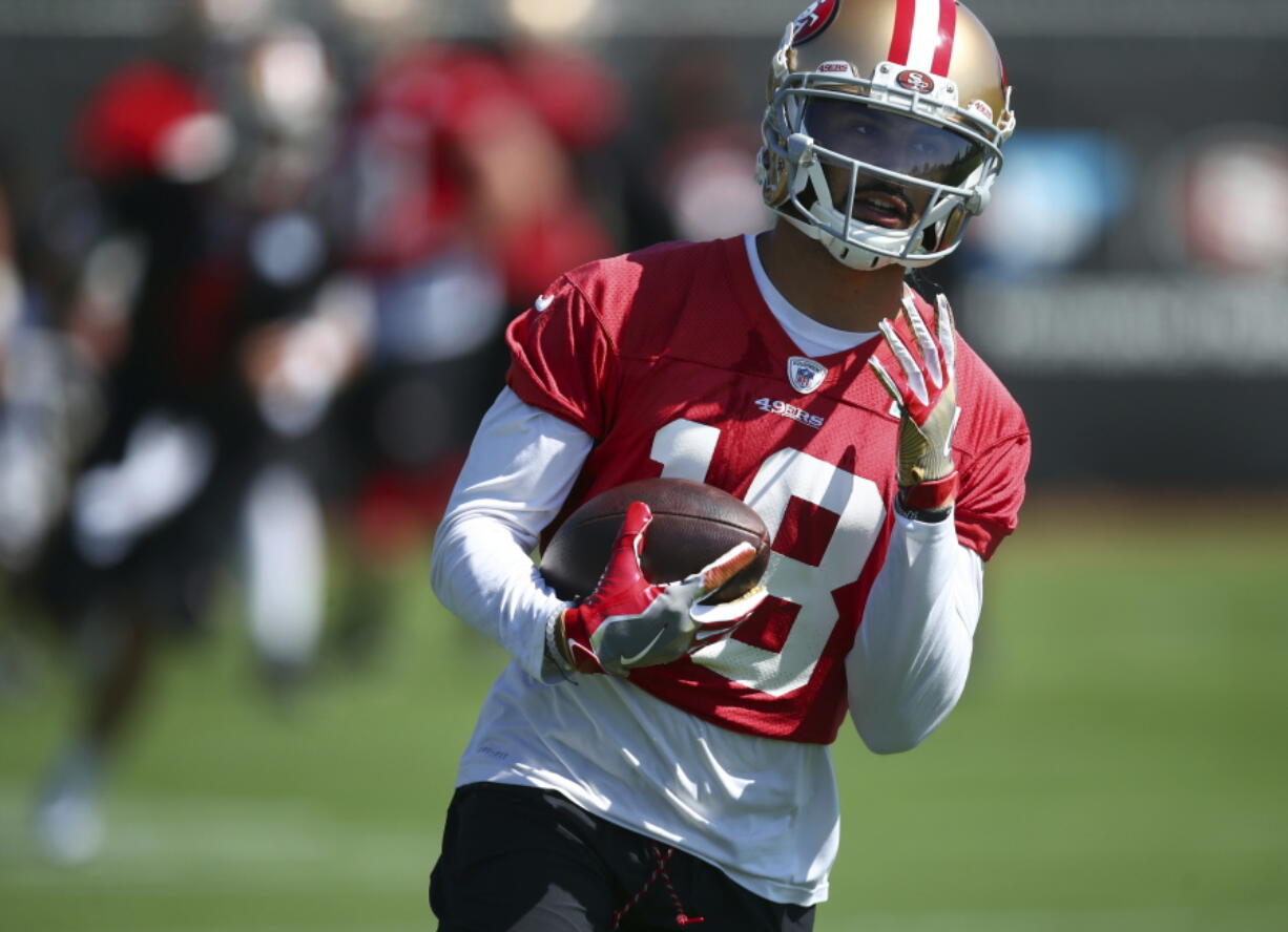 San Francisco 49ers wide receiver Dante Pettis runs during NFL football practice at the team’s headquarters Thursday, July 26, 2018, in Santa Clara, Calif.