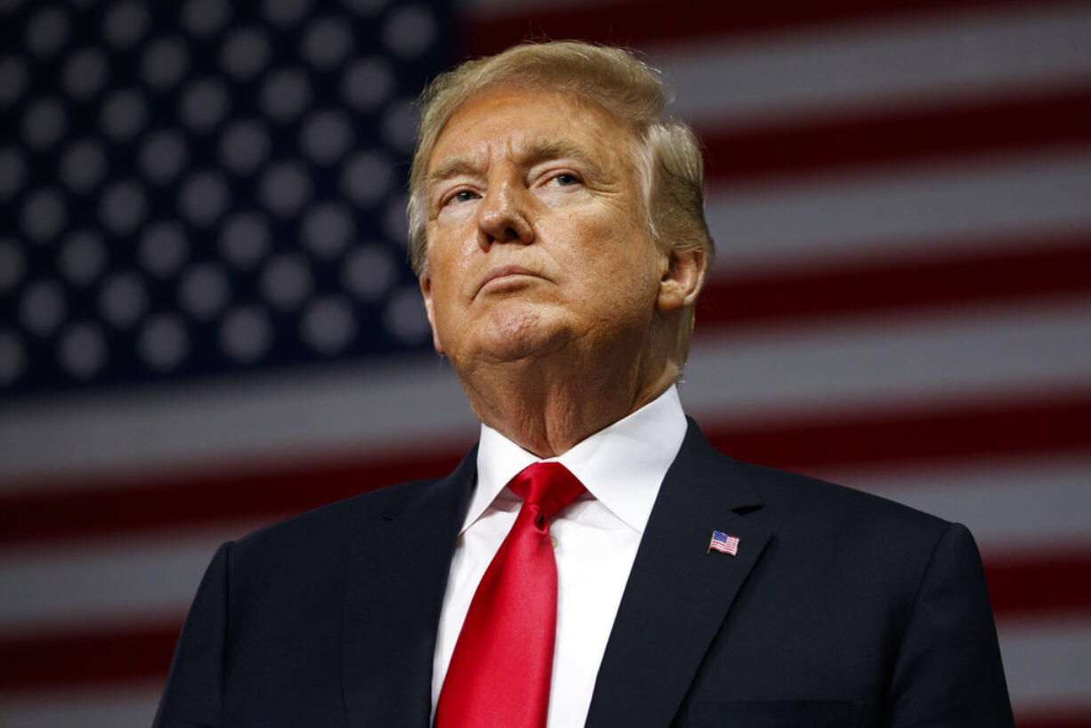 President Donald Trump listens during a campaign rally at Florida State Fairgrounds Expo Hall, Tuesday, July 31, 2018, in Tampa, Fla.