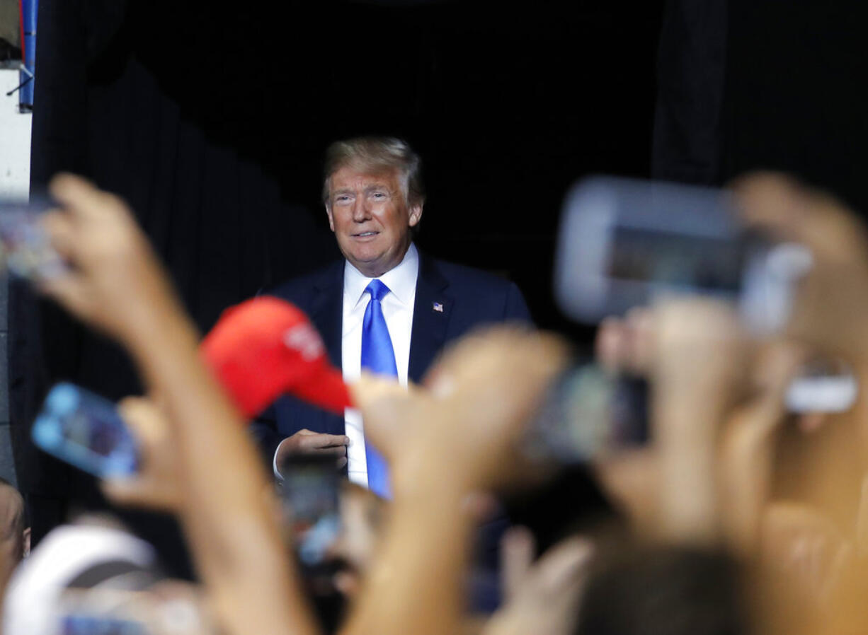 President Donald Trump arrives at a rally, Thursday, Aug. 2, 2018, at Mohegan Sun Arena at Casey Plaza in Wilkes Barre, Pa.