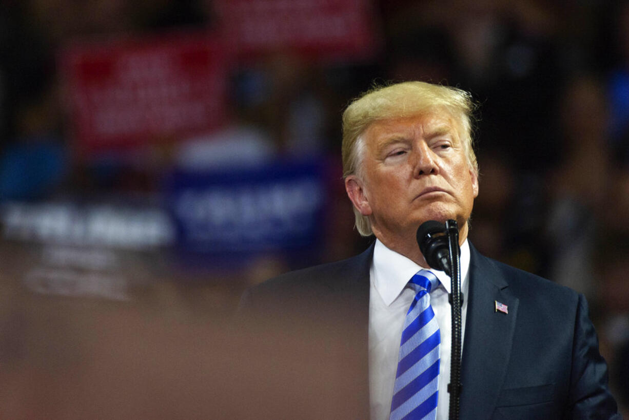 President Donald Trump takes the stage at a rally in support of the Senate candidacy of West Virginia's Attorney General Patrick Morrisey, Tuesday, Aug. 21, 2018, at the Charleston Civic Center in Charleston, W.Va.