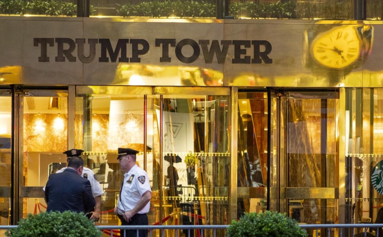 In this July 27, 2018 photo, police investigate the report of a “suspicious item” inside Trump Tower on Fifth Avenue, in New York. AP explains why the Trump Tower meeting matters in the Mueller probe.